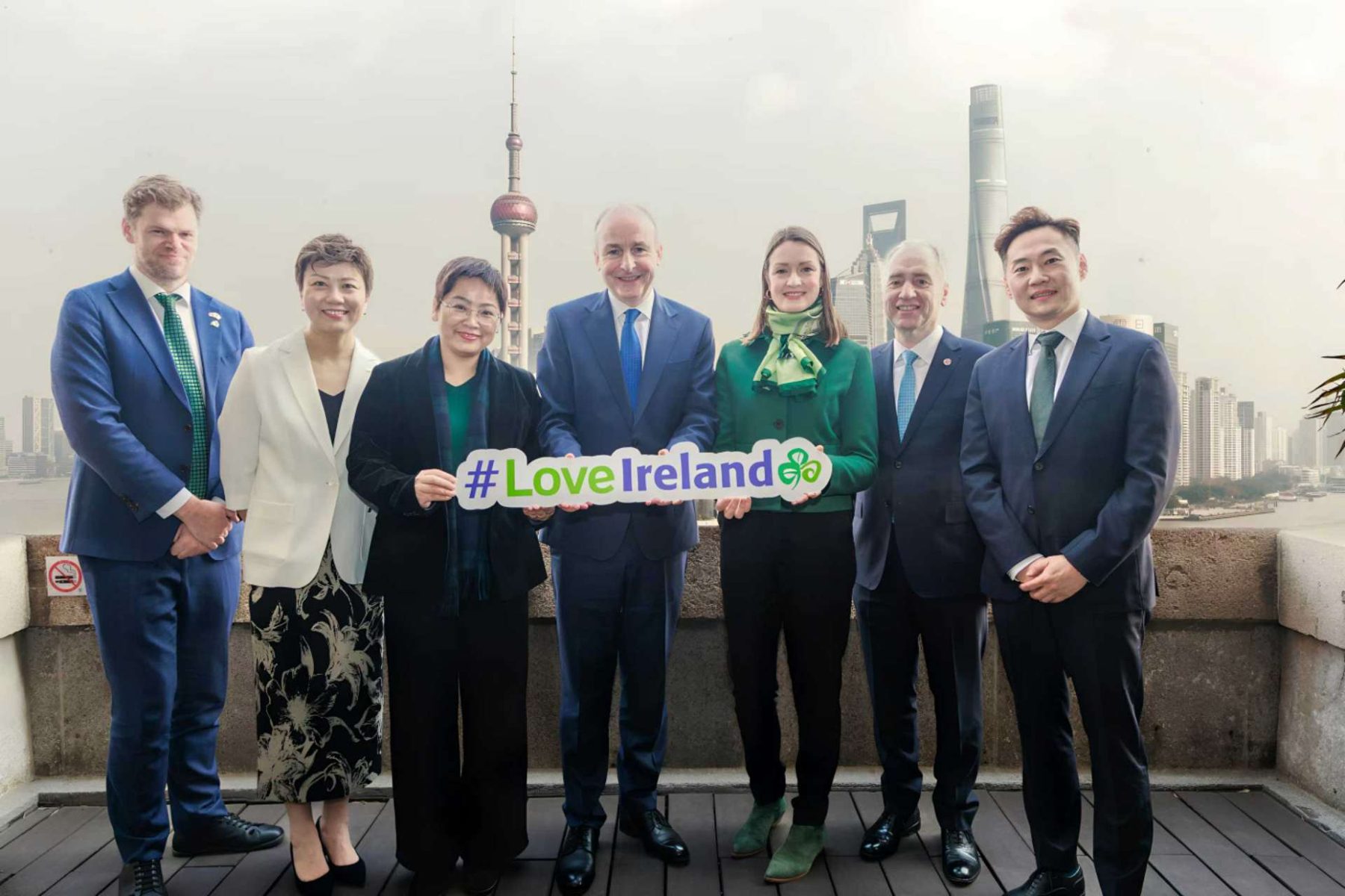 Irish tourism delegation in China holding a Love Ireland sign